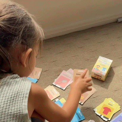Toddler playing with AussieMate flashcards